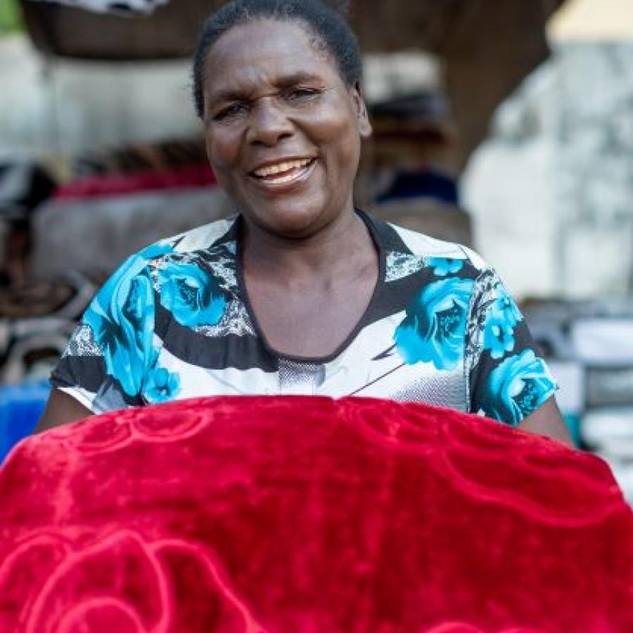  Caption: A cross border trader at the Zimbabwe Market in Livingstone beams with smile. Photo Credit @Moses Zangar Jr 